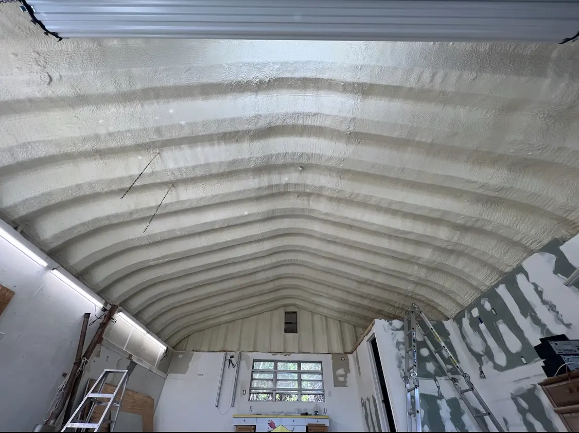Spray polyurethane foam applied to the underside of a metal roof deck in Presque Isle